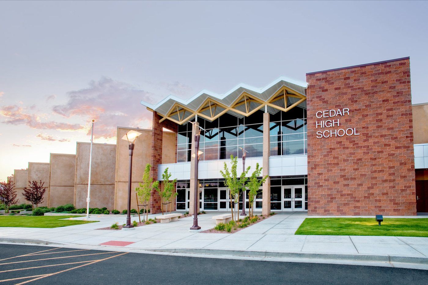 The main entrance of Cedar High School in Cedar City at dusk.