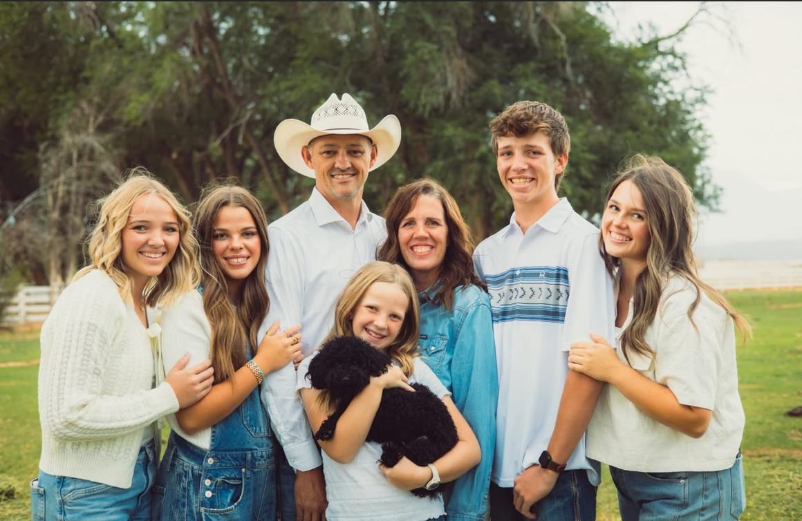 Adam Hahn with his wife and five children on a ranch outside Cedar City, Utah.
